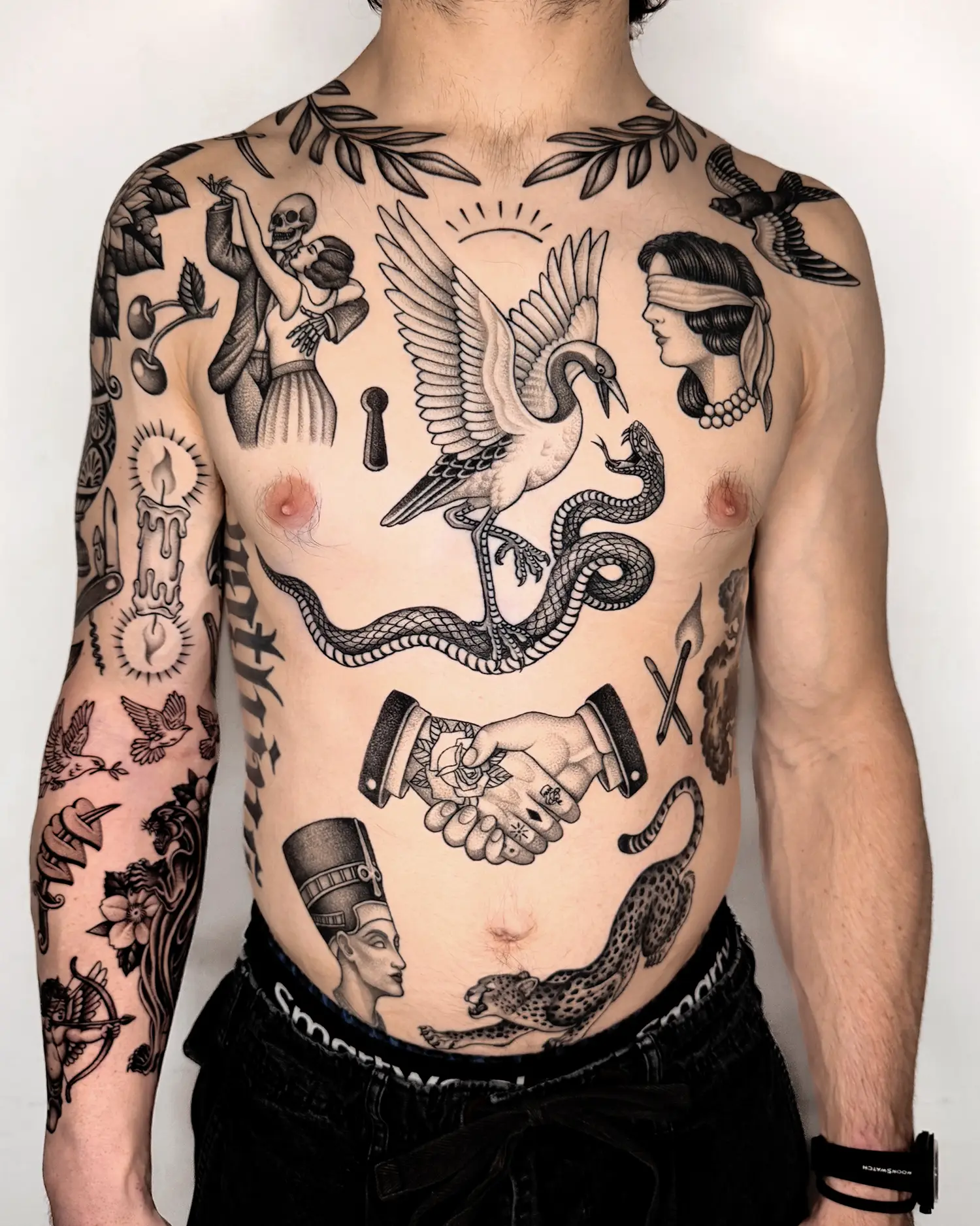 torso with old school european style tattoos in black ink by jae